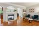 Open concept living room with a fireplace, hardwood floors and natural light at 3895 Old Atlanta Station Se Dr # 1, Atlanta, GA 30339