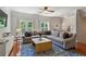 Spacious living room with a large comfortable couch, hardwood floors and neutral paint at 3895 Old Atlanta Station Se Dr # 1, Atlanta, GA 30339