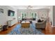 Bright living room with hardwood floors, ceiling fan and lots of natural light at 3895 Old Atlanta Station Se Dr # 1, Atlanta, GA 30339
