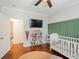 A cozy Bedroom featuring painted accent wall and decorative bookcase at 265 Haas Se Ave, Atlanta, GA 30316