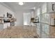 Bright, airy kitchen with granite countertops, stainless steel appliances, and a view into the dining room at 265 Haas Se Ave, Atlanta, GA 30316