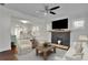 Spacious living room flows into the dining area, featuring a modern fireplace at 265 Haas Se Ave, Atlanta, GA 30316
