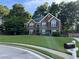 Charming brick two-story home with manicured lawn and classic curb appeal in a desirable neighborhood at 990 Fountain Glen Dr, Lawrenceville, GA 30043