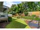 Lush backyard with a raised garden bed, wood fence and steps at 1090 Shepherds Ne Ln, Atlanta, GA 30324