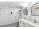 Bathroom featuring glass-enclosed shower, marble counters and double sink vanity at 1090 Shepherds Ne Ln, Atlanta, GA 30324