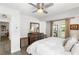 Sunlit bedroom with ceiling fan and private deck access through glass doors at 1090 Shepherds Ne Ln, Atlanta, GA 30324