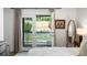 Cozy bedroom with double doors opening to a private backyard deck at 1090 Shepherds Ne Ln, Atlanta, GA 30324