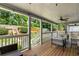 Spacious covered deck with outdoor seating, overlooking a lush green landscape at 1090 Shepherds Ne Ln, Atlanta, GA 30324