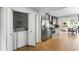 Modern kitchen with stainless steel appliances and adjacent laundry area at 1090 Shepherds Ne Ln, Atlanta, GA 30324