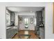 Modern kitchen with gray cabinets, stainless steel appliances, and hardwood floors at 1090 Shepherds Ne Ln, Atlanta, GA 30324