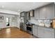 Updated kitchen featuring stainless appliances, light gray cabinetry, and hardwood floors at 1090 Shepherds Ne Ln, Atlanta, GA 30324