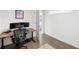 Bright home office with a large desk, ergonomic chair, and hardwood floors at 1090 Shepherds Ne Ln, Atlanta, GA 30324