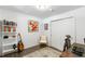 Well-lit home office with a bookcase, accent chair, and modern desk setup at 1090 Shepherds Ne Ln, Atlanta, GA 30324