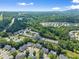 An aerial view shows the community, highway access and surrounding green space at 1628 Indian Way, Cumming, GA 30040