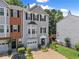 Well-kept townhome featuring a combination of brick and siding facade, along with verdant landscaping at 1628 Indian Way, Cumming, GA 30040