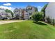 Lovely townhome with a spacious green lawn, driveway, and garden area at 1628 Indian Way, Cumming, GA 30040