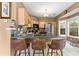 Cozy kitchen featuring a breakfast bar with seating, stainless steel appliances, and ample cabinet space at 1628 Indian Way, Cumming, GA 30040