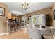 Charming eat-in kitchen with stainless steel appliances, a breakfast bar, and a view to the backyard at 1628 Indian Way, Cumming, GA 30040