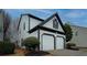 Attractive two-story home showing the siding, trim, garage, and landscaping at 2587 Alvecot Se Cir, Atlanta, GA 30339