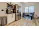 Bright breakfast nook featuring stainless steel refrigerator, microwave and dining area at 2587 Alvecot Se Cir, Atlanta, GA 30339