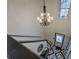 Stylish staircase with chandelier and marble flooring leads to the upper level at 2587 Alvecot Se Cir, Atlanta, GA 30339