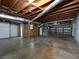 Unfinished basement featuring a garage door, support beams, and visible utilities at 286 Sequoia Ne Dr, Marietta, GA 30060