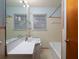 This bathroom features a toilet, a bathtub, a sink, and a vanity with a large mirror at 286 Sequoia Ne Dr, Marietta, GA 30060