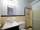 This bathroom features a shower, toilet, sink, and a mirror on the wall at 286 Sequoia Ne Dr, Marietta, GA 30060