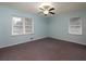 Comfortable bedroom with light blue walls, two large windows, and a ceiling fan at 286 Sequoia Ne Dr, Marietta, GA 30060