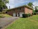 Exterior view of a two-story brick home with a two-car garage and well-maintained landscaping at 286 Sequoia Ne Dr, Marietta, GA 30060