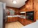 Well-lit kitchen with stainless steel refrigerator, modern appliances, and warm wood cabinetry at 286 Sequoia Ne Dr, Marietta, GA 30060