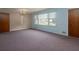 Large living room with big windows providing natural light; carpeted throughout at 286 Sequoia Ne Dr, Marietta, GA 30060