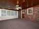 Cozy sunroom with brick wall, multiple windows, a ceiling fan, and natural light at 286 Sequoia Ne Dr, Marietta, GA 30060