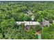Aerial view of a condo building surrounded by lush greenery and a swimming pool at 302 Ridley Howard Ct # 302, Decatur, GA 30030