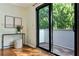 Cozy interior features a table and stool next to a sliding glass door leading to balcony at 302 Ridley Howard Ct # 302, Decatur, GA 30030