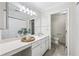Bright bathroom featuring a large vanity, spacious countertops, and separate toilet room at 302 Ridley Howard Ct # 302, Decatur, GA 30030
