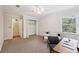 Spacious bedroom features plush carpeting, natural light, ceiling fan and a large closet at 302 Ridley Howard Ct # 302, Decatur, GA 30030