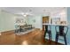 Open concept dining area has seating for six, hardwood floors, and views of the kitchen at 302 Ridley Howard Ct # 302, Decatur, GA 30030