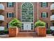Elegant brick building entrance with a large arched window above the double doors at 302 Ridley Howard Ct # 302, Decatur, GA 30030