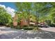 Brick building with lots of trees and parking. This home is beautiful and serene at 302 Ridley Howard Ct # 302, Decatur, GA 30030