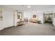 Elegant hallway featuring neutral carpet, classic furnishings, and decorative accents creating a welcoming atmosphere at 302 Ridley Howard Ct # 302, Decatur, GA 30030