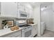 Clean kitchen featuring white cabinets, modern appliances, and countertop space at 302 Ridley Howard Ct # 302, Decatur, GA 30030