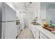 Efficient kitchen with white appliances and cabinetry at 302 Ridley Howard Ct # 302, Decatur, GA 30030