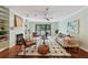 Bright living room with stylish furniture, hardwood floors, and a sliding door to the balcony at 302 Ridley Howard Ct # 302, Decatur, GA 30030