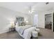 Comfortable main bedroom with carpet, ceiling fan, and neutral walls is move-in ready at 302 Ridley Howard Ct # 302, Decatur, GA 30030