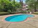 Inviting outdoor pool surrounded by lush greenery, offering a refreshing retreat on a sunny day at 302 Ridley Howard Ct # 302, Decatur, GA 30030