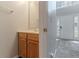 Half bathroom with a wood cabinet sink and a view of the front door at 6181 E Fayetteville Dr, Riverdale, GA 30296