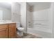 Bathroom features a combination tub and shower, single sink vanity, and modern fixtures at 6181 E Fayetteville Dr, Riverdale, GA 30296