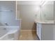 Bathroom with a bathtub and shower combination, and a single sink vanity at 6181 E Fayetteville Dr, Riverdale, GA 30296