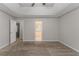 Spacious main bedroom features carpet, neutral walls, and an en suite bathroom at 6181 E Fayetteville Dr, Riverdale, GA 30296